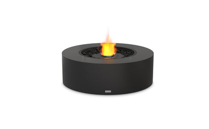 Black round fire pit with flames on a white background