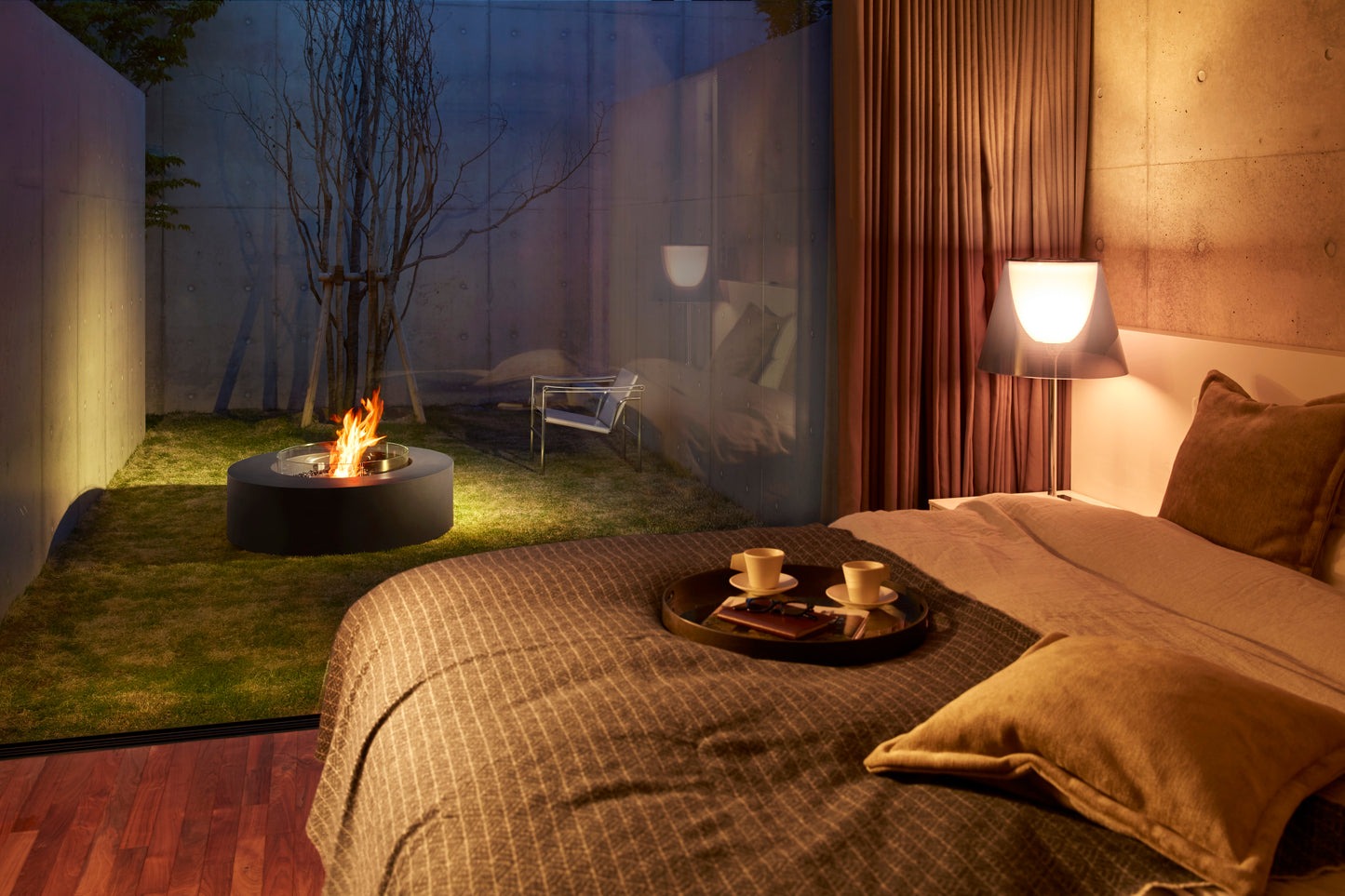 Bedroom with a fire pit outside, creating a cozy outdoor-indoor ambiance.