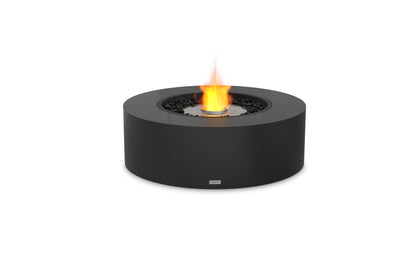 Black round fire pit with flames on a white background