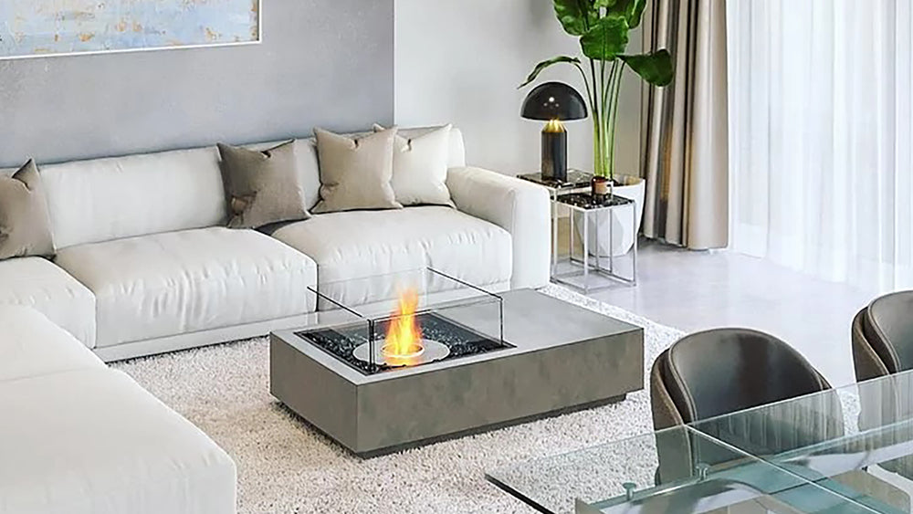 Modern living room with an ethanol fire pit table and white sectional sofa.