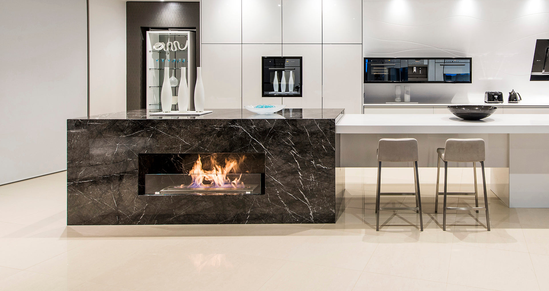 Modern kitchen with a built-in fireplace and sleek design.