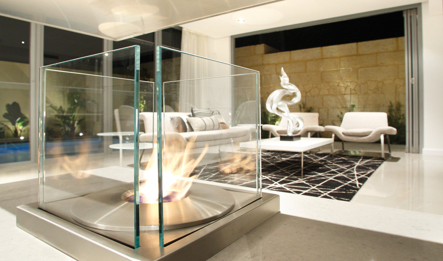 Modern living room with a glass-enclosed fireplace.