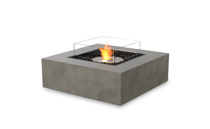 Square concrete fire pit with glass cover on a white background