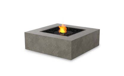 Square concrete fire pit table with flames on a white background