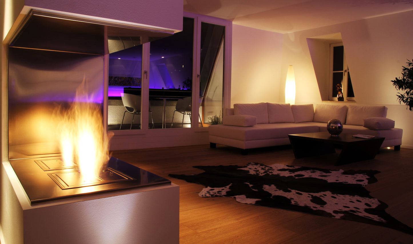 Modern living room with a fireplace and white sofa.