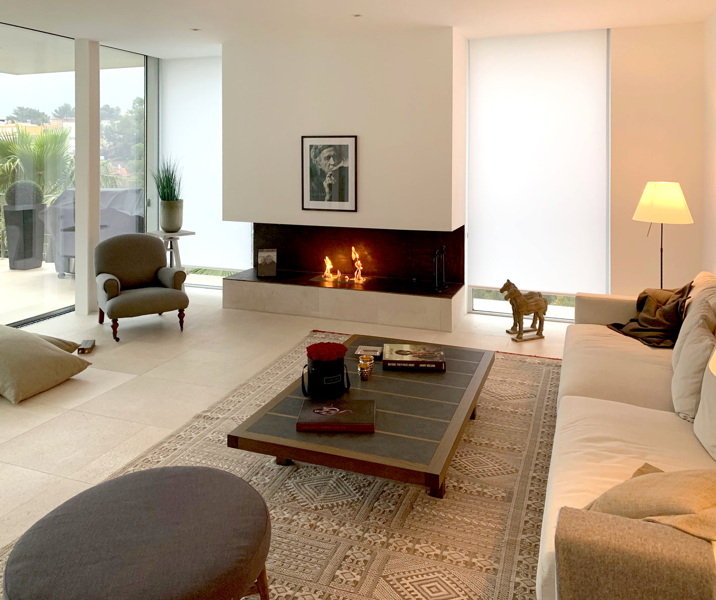 Modern living room with a fireplace, sofa, and coffee table.