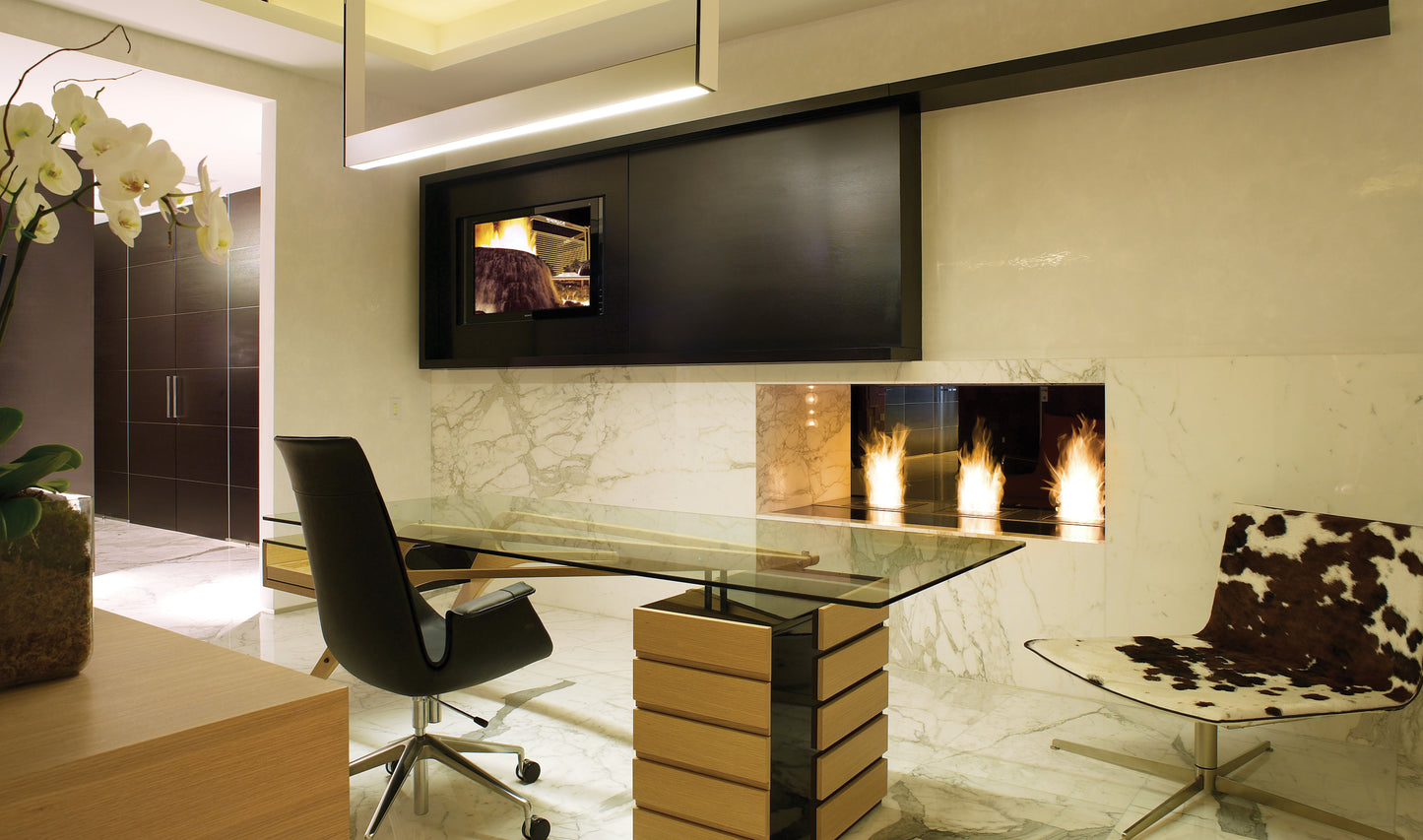 Modern office interior with a desk, chair, and wall-mounted TV.