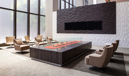 Modern office lobby with a fire pit table and chairs