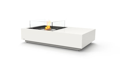 Modern white fire pit table with visible flames on a white background