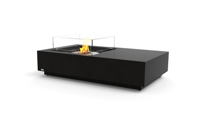 Modern black fire pit table with flames on a white background