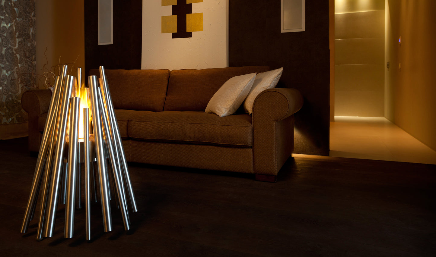 Modern interior with a brown sofa and metallic lamp in a dimly lit room.