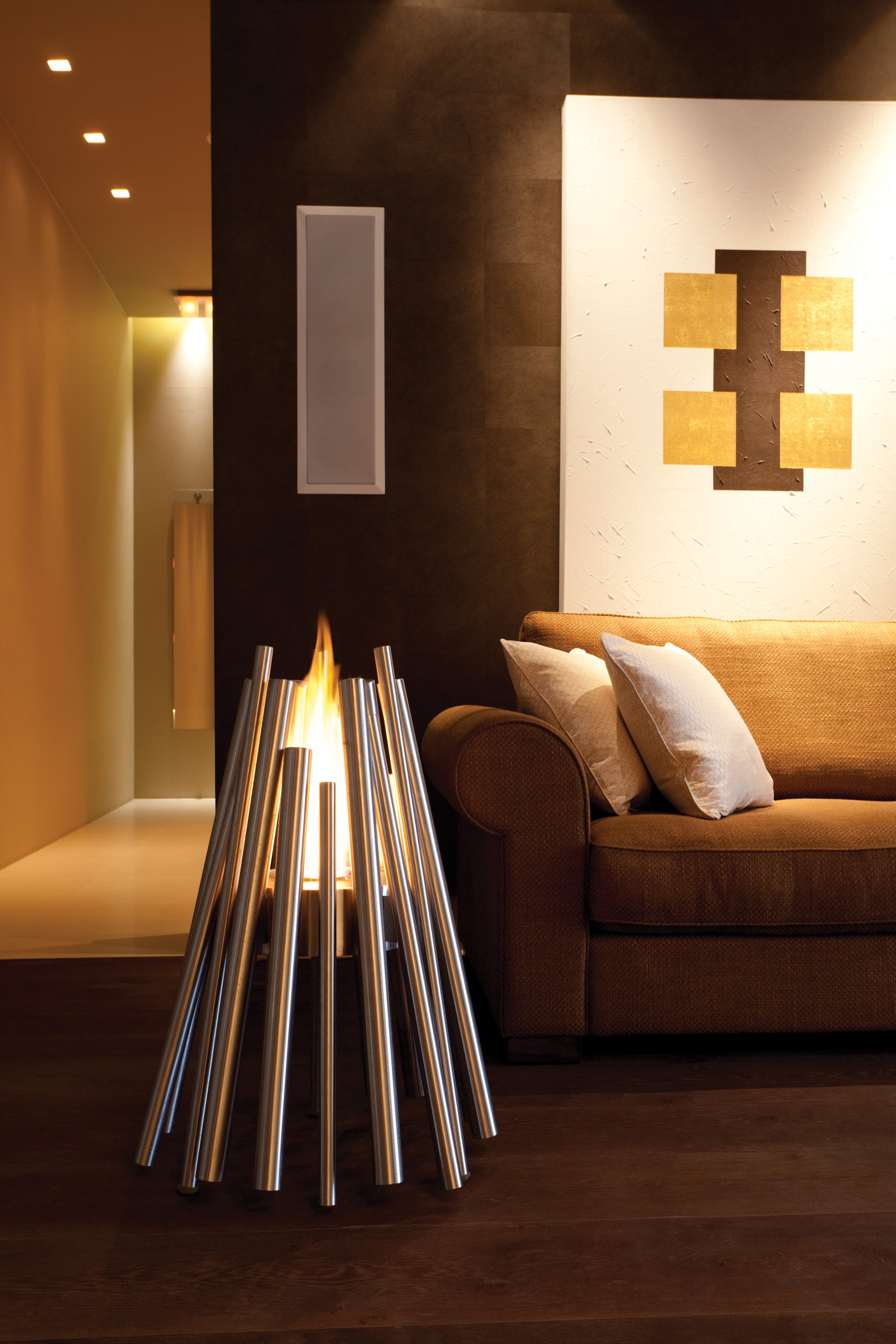 Modern interior design with a floor lamp and sofa in a dimly lit room.