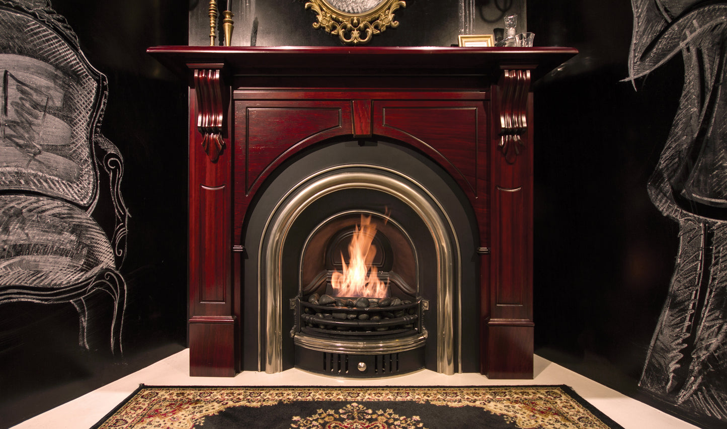 Decorative fireplace with a lit fire, surrounded by ornate furniture.