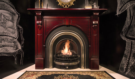 Decorative fireplace with a lit fire, surrounded by ornate furniture.