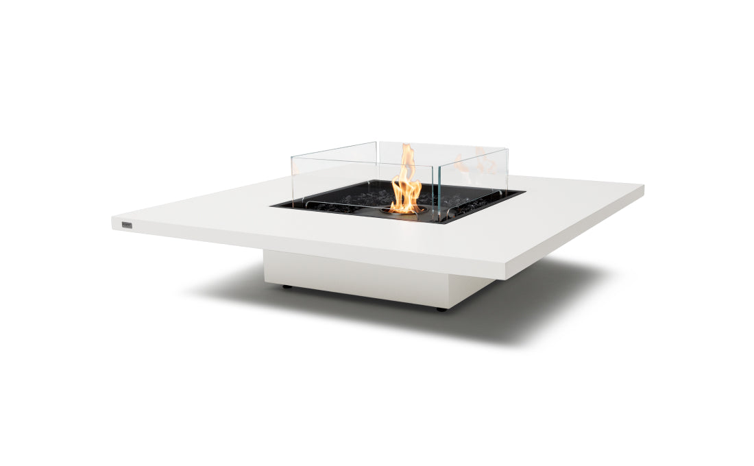 Modern outdoor fire pit table with flames on a white background