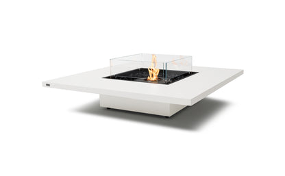 Modern outdoor fire pit table with flames on a white background