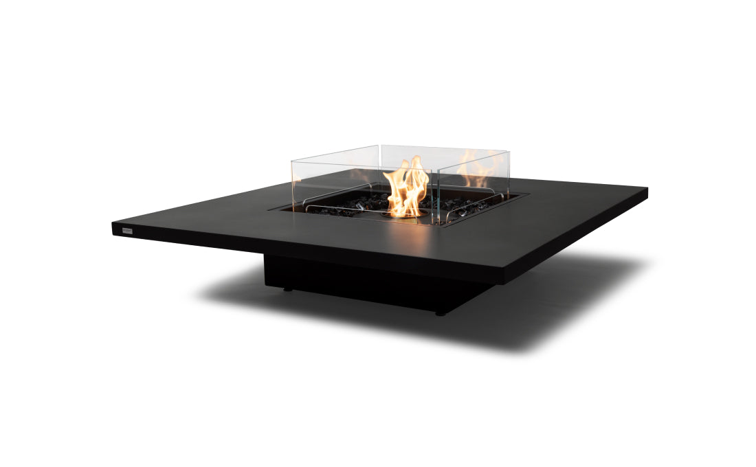 Modern black fire pit table with flames on a white background
