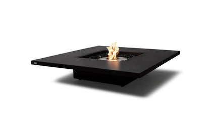 Modern black fire pit table with flames on a white background