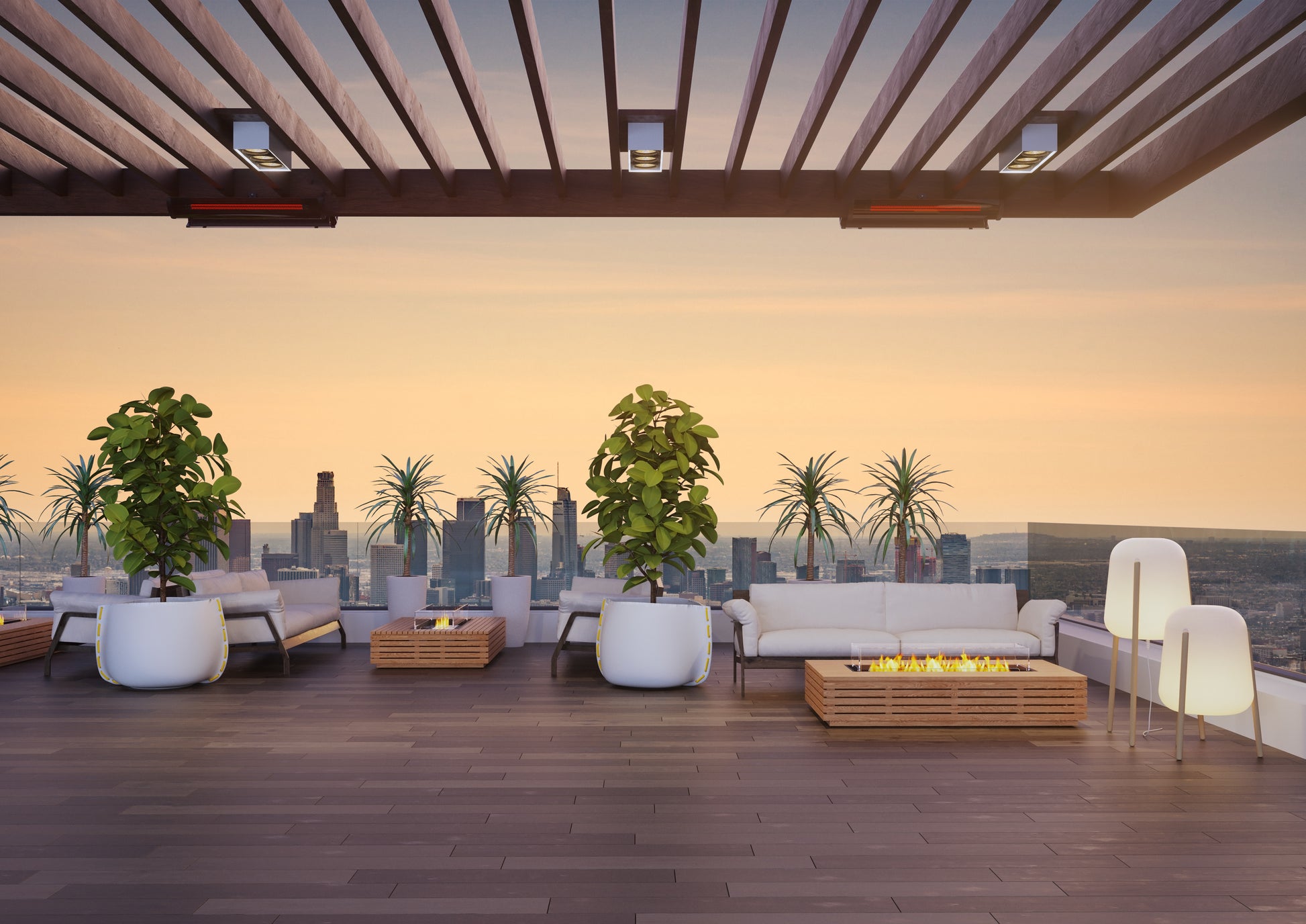 Modern rooftop patio with city skyline view, seating area, and fire pit.