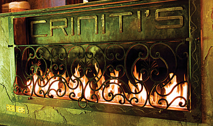Decorative fireplace cover with 'Criniti's' branding and visible flames.