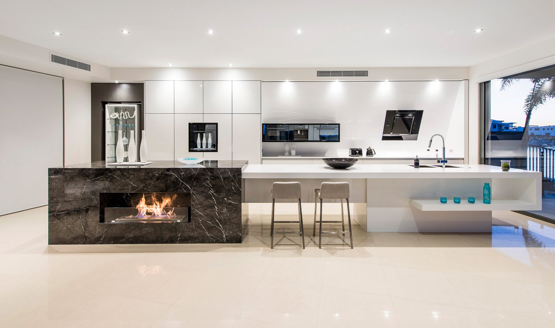 Modern kitchen with marble island and white cabinets