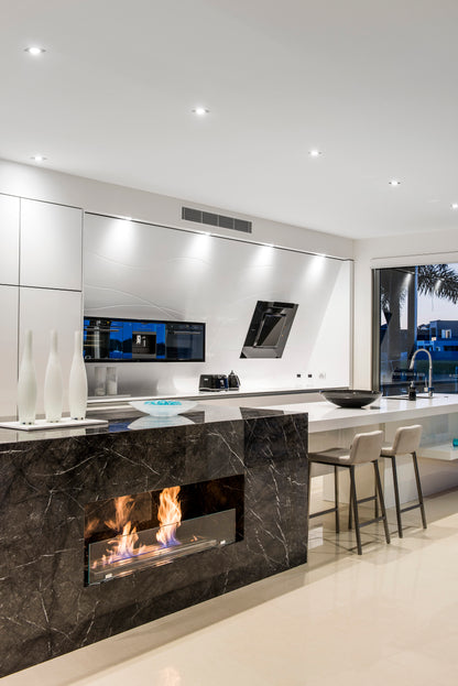 Modern kitchen with a built-in fireplace and white cabinetry.