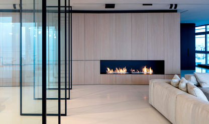 Modern living room with a fireplace and glass partition
