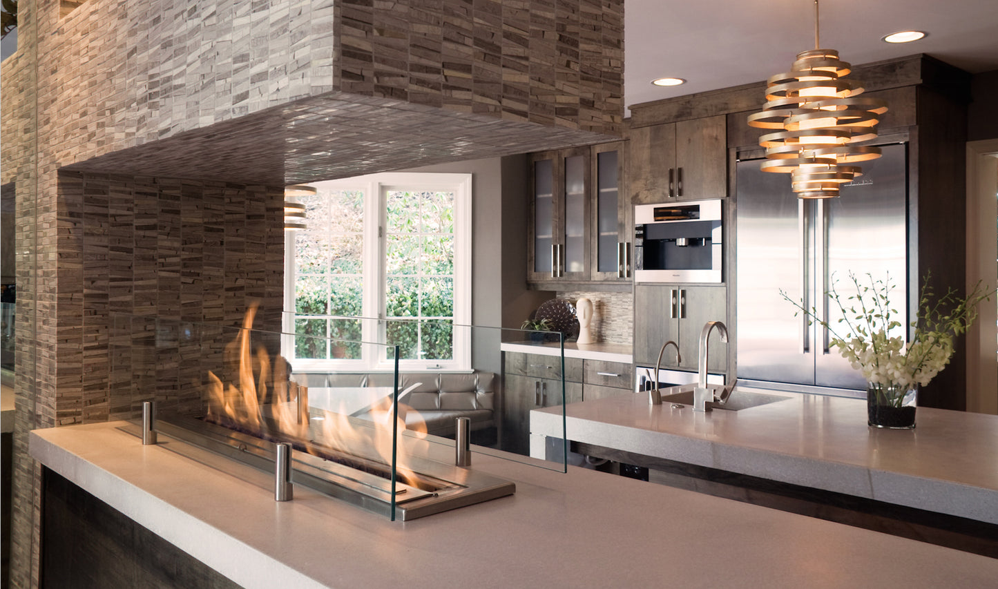 Modern kitchen with stone fireplace and stainless steel appliances