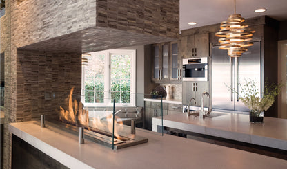 Modern kitchen with stone fireplace and stainless steel appliances