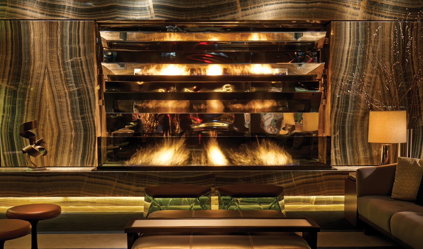 Luxurious interior with a large fireplace and decorative wall.