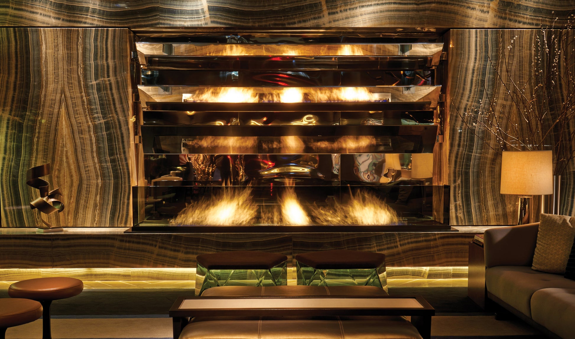 Luxurious interior with a large fireplace and decorative wall.