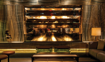 Luxurious interior with a large fireplace and decorative wall.