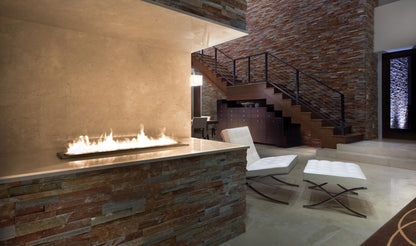 Modern interior with a stone fireplace and staircase