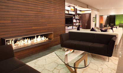 Modern living room with a fireplace, sofa, and glass coffee table.