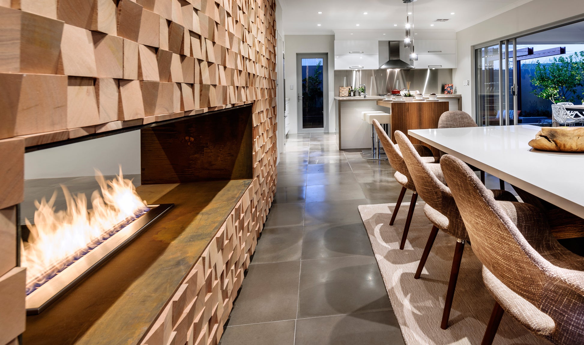 Modern living room with a fireplace and dining area