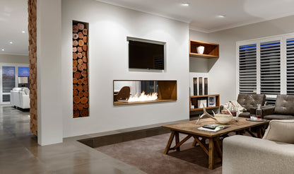 Modern living room with a fireplace, television, and decorative elements.