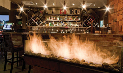 Bar with a fireplace and wine racks in a dimly lit room